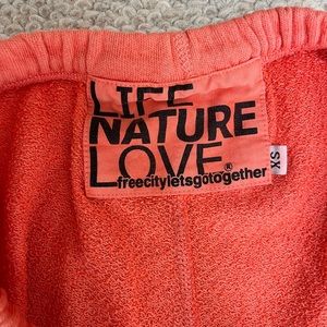 Free city sweatpants XS. Orange/faded orange. Good preowned condition.